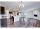 Spacious living area with a fireplace, wood-look floors and an open concept kitchen at 3162 Retama Run # 231, Apex, NC 27562