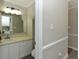 Well-maintained bathroom with large vanity, bright light fixture and neutral wall color at 3313 Ventura Cir, Wake Forest, NC 27587