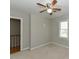 Bright bedroom features neutral carpet, ceiling fan, and a window allowing natural light at 3313 Ventura Cir, Wake Forest, NC 27587