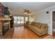 Spacious living room features hardwood floors, a brick fireplace, and ample natural light at 3313 Ventura Cir, Wake Forest, NC 27587