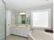 Spacious bathroom with double vanity, soaking tub, and a separate shower area at 3313 Ventura Cir, Wake Forest, NC 27587