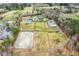Extensive equestrian property featuring a house, barn, pastures, paddocks, and riding ring at 3417 Pea Ridge Rd, New Hill, NC 27562
