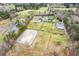 Expansive estate aerial featuring a home, horse pastures, riding arena, and outbuildings at 3417 Pea Ridge Rd, New Hill, NC 27562