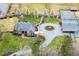Aerial view showcasing the home, driveway, and landscaped front yard at 3417 Pea Ridge Rd, New Hill, NC 27562