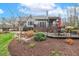 A well-maintained home exterior featuring a beautiful backyard patio and landscaped garden at 3417 Pea Ridge Rd, New Hill, NC 27562