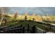 Spacious backyard view from deck with a rainbow, lush lawn, and mature trees at 3417 Pea Ridge Rd, New Hill, NC 27562