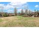 Expansive backyard with beautiful trees, offering a serene and private outdoor space at 3417 Pea Ridge Rd, New Hill, NC 27562