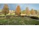 Manicured backyard featuring a lush lawn and mature shade trees along a fence line at 3417 Pea Ridge Rd, New Hill, NC 27562