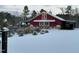 Snow covered property featuring a large red barn with decorative details at 3417 Pea Ridge Rd, New Hill, NC 27562