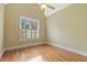 Bright bedroom with hardwood floors and plantation shutters at 3417 Pea Ridge Rd, New Hill, NC 27562