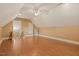 Bonus room with hardwood floors, angled ceilings, a ceiling fan, and access to the attic at 3417 Pea Ridge Rd, New Hill, NC 27562