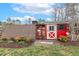 A charming red chicken coop adds character to the property's outdoor space at 3417 Pea Ridge Rd, New Hill, NC 27562