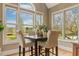Bright dining area with large windows overlooking a scenic view at 3417 Pea Ridge Rd, New Hill, NC 27562