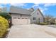Charming home with a gray exterior, a two-car garage, and a well-manicured lawn at 3417 Pea Ridge Rd, New Hill, NC 27562