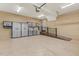 Spacious garage with storage cabinets, a utility sink, and a ramp for accessibility at 3417 Pea Ridge Rd, New Hill, NC 27562