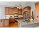 Well-appointed kitchen with stainless steel appliances, granite counters, and ample cabinet space at 3417 Pea Ridge Rd, New Hill, NC 27562