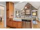 Open concept kitchen with stainless steel appliances and a farmhouse sink at 3417 Pea Ridge Rd, New Hill, NC 27562