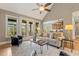 Open living room featuring vaulted ceiling, French doors, and seamless access to kitchen at 3417 Pea Ridge Rd, New Hill, NC 27562