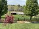Pasture featuring horses grazing, wooden fencing, and a shelter at 3417 Pea Ridge Rd, New Hill, NC 27562