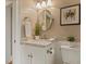 Charming powder room featuring a marble countertop and stylish fixtures at 3417 Pea Ridge Rd, New Hill, NC 27562