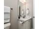 Updated bathroom with white cabinetry, and marble countertops at 345 Anterbury Dr, Apex, NC 27502