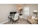 Comfortable bedroom furnished with desk, computer, and armchair at 345 Anterbury Dr, Apex, NC 27502