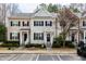 Charming townhome featuring a well-maintained front yard with tasteful landscaping and neutral siding at 345 Anterbury Dr, Apex, NC 27502