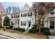 Charming townhome with a well-maintained lawn, black shutters, and a cozy entrance, radiating suburban appeal at 345 Anterbury Dr, Apex, NC 27502