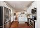 Well-lit kitchen with stainless steel appliances and an open layout leading to the living room at 345 Anterbury Dr, Apex, NC 27502