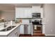 Well-appointed kitchen featuring stainless steel appliances, stylish cabinetry, and quartz countertops at 345 Anterbury Dr, Apex, NC 27502