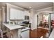Charming kitchen with a view of the dining area, creating a warm and connected living space at 345 Anterbury Dr, Apex, NC 27502