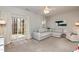 Spacious living area featuring a neutral sectional sofa and sliding glass doors at 345 Anterbury Dr, Apex, NC 27502