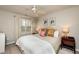 Serene main bedroom with a king-sized bed, decorative pillows, and natural light from the window at 345 Anterbury Dr, Apex, NC 27502