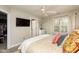 Main bedroom features a walk-in closet, television, and ample natural light, creating a relaxing atmosphere at 345 Anterbury Dr, Apex, NC 27502