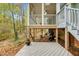 Spacious backyard with a deck, porch and lush foliage at 4117 Olde Coach Rd, Durham, NC 27707