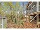 Backyard with screened porch, shed, and mature trees at 4117 Olde Coach Rd, Durham, NC 27707