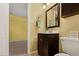 Bathroom featuring a single sink vanity, updated lighting, and great design at 4117 Olde Coach Rd, Durham, NC 27707