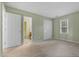 Bedroom with carpet floors, natural light, and a double door closet at 4117 Olde Coach Rd, Durham, NC 27707