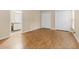 Bedroom with hardwood floors and two double door closets for optimal storage at 4117 Olde Coach Rd, Durham, NC 27707