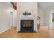 Elegant fireplace featuring a white mantle with a black firebox at 4117 Olde Coach Rd, Durham, NC 27707