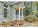 Close up exterior view of a home's front porch with a dark blue front door at 4117 Olde Coach Rd, Durham, NC 27707