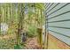 Garden archway with gate leading to wooded property at 4117 Olde Coach Rd, Durham, NC 27707
