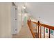 Hallway featuring carpet floors, natural light, and access to multiple rooms at 4117 Olde Coach Rd, Durham, NC 27707