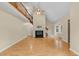 Open concept living area features a fireplace, vaulted ceilings, wood floors and lots of natural light at 4117 Olde Coach Rd, Durham, NC 27707