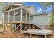 Lovely screened porch featuring skylights and wooden deck, perfect for outdoor relaxation and entertaining at 4117 Olde Coach Rd, Durham, NC 27707