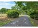 Long, paved driveway leading to the property at 4811 New Sharon Church Rd, Hillsborough, NC 27278