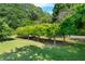 Lush greenery lines the exterior of this home's long driveway at 4811 New Sharon Church Rd, Hillsborough, NC 27278