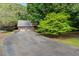 Home's exterior with a two-car garage and large driveway at 4811 New Sharon Church Rd, Hillsborough, NC 27278