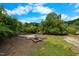 Exterior fire pit with a surrounding stone walk at 4811 New Sharon Church Rd, Hillsborough, NC 27278