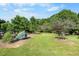 Well-manicured lawn with mature trees and bushes, creating a serene outdoor space at 4811 New Sharon Church Rd, Hillsborough, NC 27278